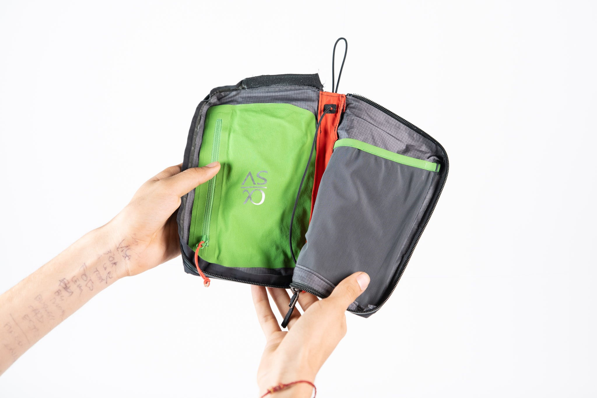 The opening gesture shows the pouch as an interface, not only as a container.