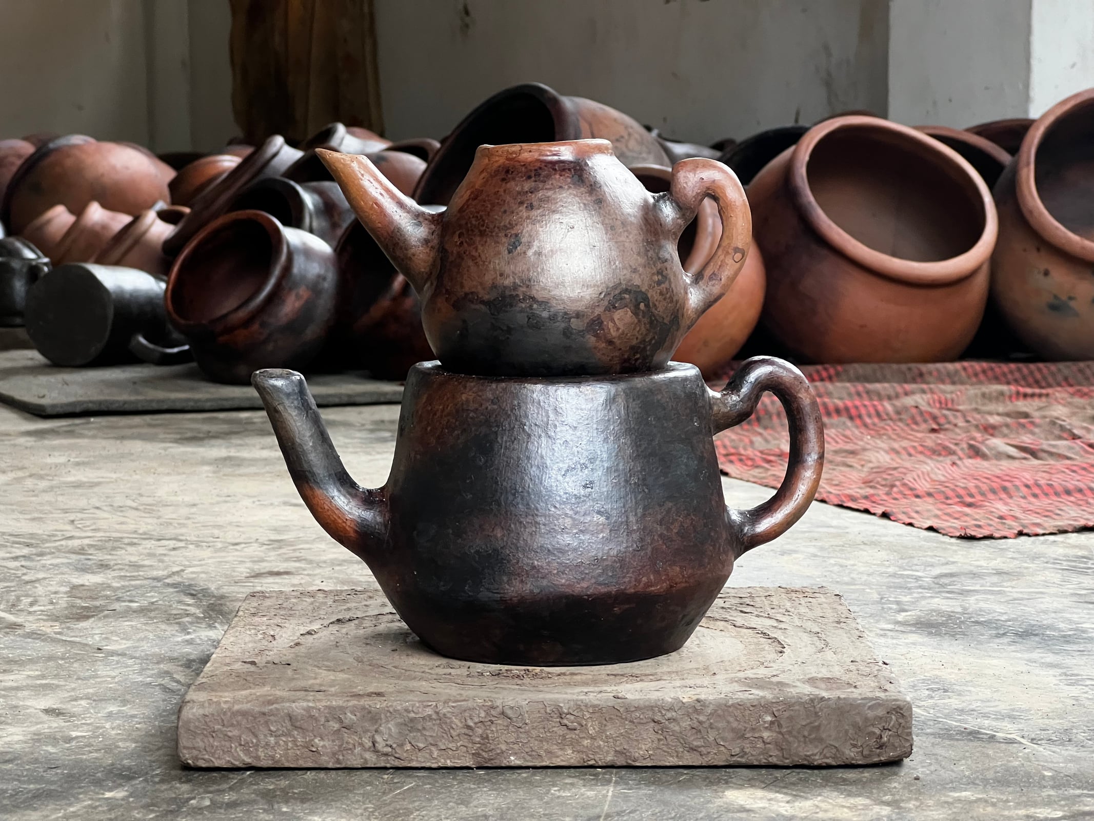 The single teapot shows proportion, surface, and material character.